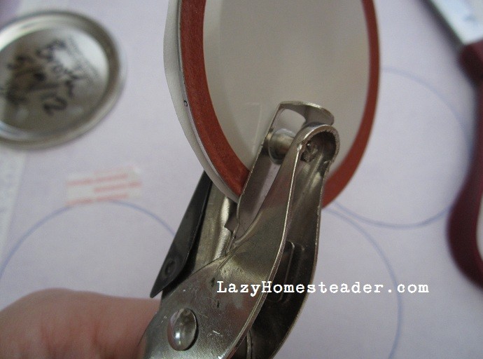 Use a hole punch to make a straw hole.